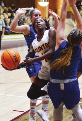 CDN | Collin Wieder � Clinton sophomore point guard Carmella Jefferson took over games this year. The young, allconference guard led the Lady Reds to a secondstraight district title win.