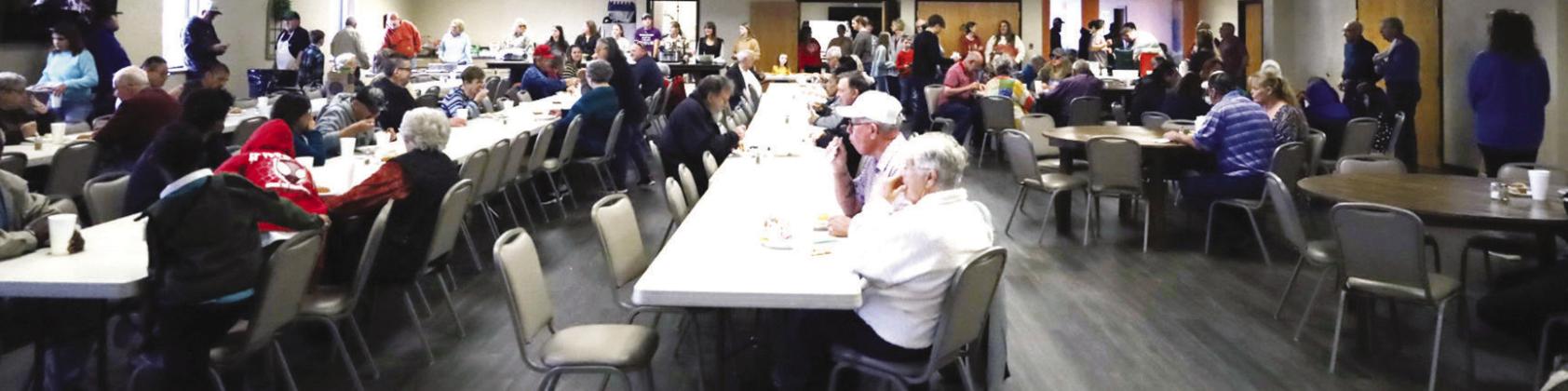 A large crowd of volunteers and guests gather at the annual Cornerstone Church Thanksgiving Feed.