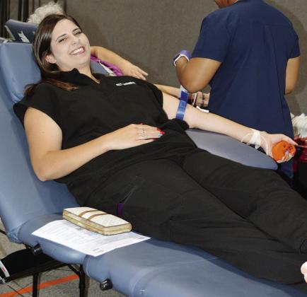 Shelby Wilson donates blood for the Clinton Community Blood Drive Tuesday at the First Christian Church.