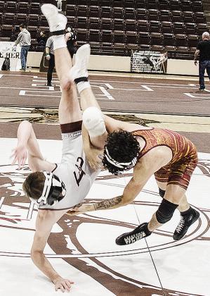 Clinton’s Tristan Cardenas, right, throws his opponent to the mat during the District Duals in Elk City. CDN | Sam Goodwyn