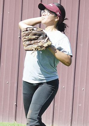 Audrina Trout aims the ball as she prepares to throw it during a practice at the softball field. CDN | Sam Goodwyn