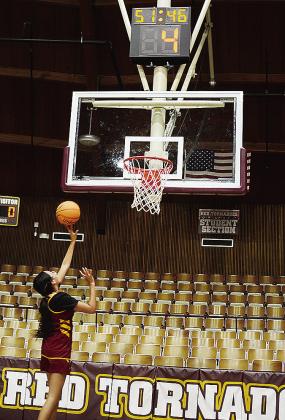 Freshman Rhianna Ellis lays the ball up and beats the newly installed shot clock during an offseason workout Wednesday in the Tornado Dome. CDN | Sam Goodwyn