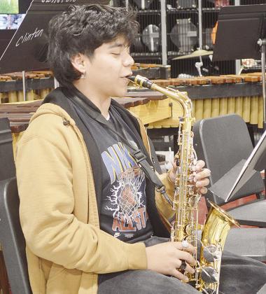 Clinton High School sophomore Korbin Guzman practices his alto saxophone piece he’s chosen to perform for solo contest.