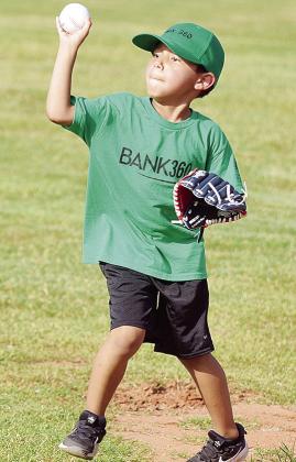 Gavino Camarillo throws the ball into the infield during the first inning of his Noon Lions T-Ball game. CDN |Sam Goodwyn