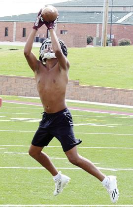 CJ Begay grabs the ball out of the air in an interception drill during practice. CDN | Sam Goodwyn
