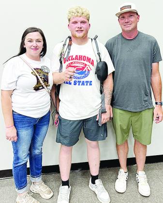 Clinton’s Marcus Wilson celebrates competing at the All-State wrestling match with his mom Shy’An Madison, left, and his dad Dallas Wilson. CDN | Courtesy photo