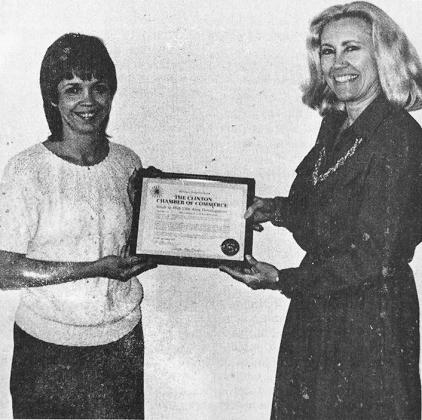 40 YEARS AGO Clinton Chamber of Commerce Executive Director Freda Stone-Meacham, at right, was shown presenting a certificate of membership to Credit Bureau of Clinton and Weatherford representative Cindy Cloninger.