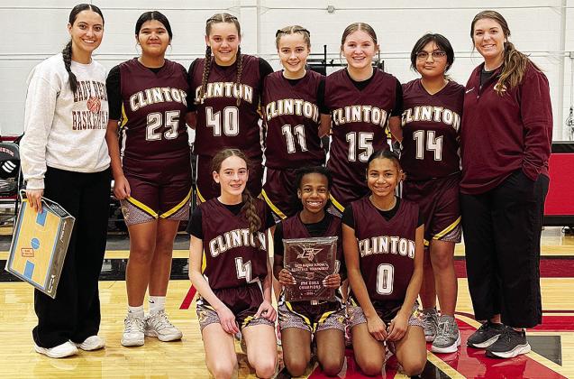 Clinton’s seventh-grade girls’ basketball team is all smiles after winning the Enid eighth-grade basketball tournament. Pictured, from left, kneeling are Madilyn Ruyle, Kynnedi Jefferson and Catileya Huddlen; back, Coach Mariah Espinosa, Daniaya Redsh