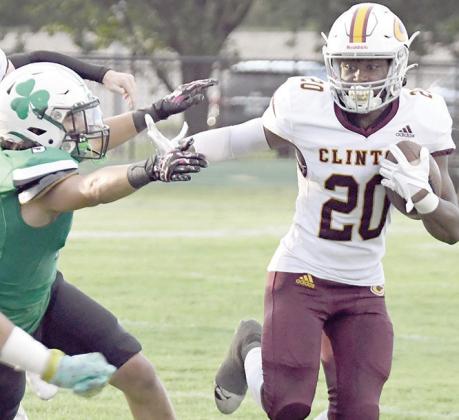 Stiff-arming a defender