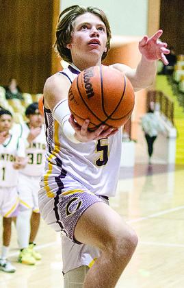 Clinton’s Braxton Garrison goes up for the rebound during the boys’ eighth-grade game against Anadarko. CDN |Sam Goodwyn
