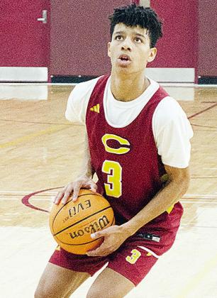 No. 3 Titan Malone aims the ball at the hoop during basketball practice. CDN | Sam Goodwyn
