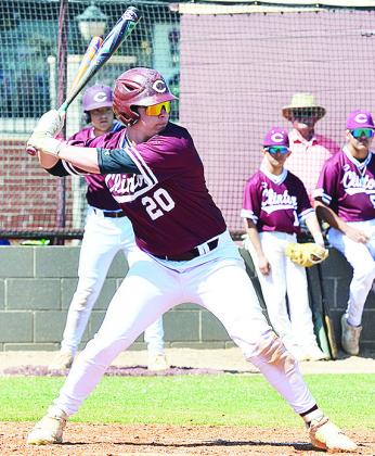 Clinton’s Brady Chittum tenses up as he prepares for the pitch in his at bat during the Reds’ home game against Bishop McGuiness. CDN | Sam Goodwyn