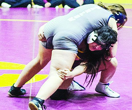 Kassandra Kaline, right, attempts a double leg during Clinton’s match Thursday against Marlow. CDN | Sam Goodwyn