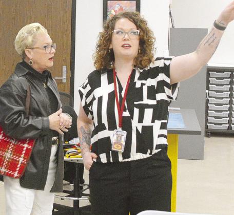 Donna Rother, left, looks in awe as art teacher Megan Malloy shows off her brand new art room during the new Clinton Middle School open house Monday evening. Classes at the new facility began Tuesday. CDN | Micah Ashcraft