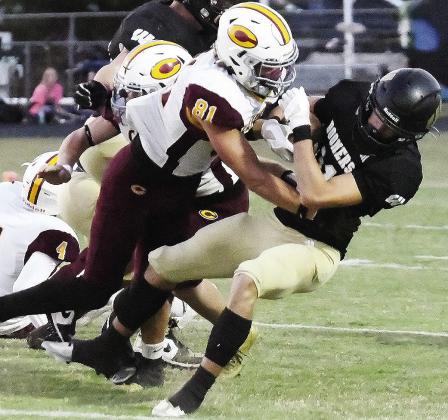 Clinton’s Ben Daugherty levels the Woodward ballcarrier during the Red Tornadoes’ win over the Boomers Thursday in Woodward. CDN | John Kinsey