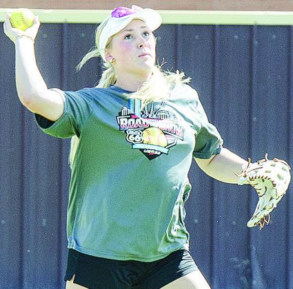 Clinton’s Rhylee Rodebush prepares to throw the ball during softball practice at the high school. CDN | Sam Goodwyn