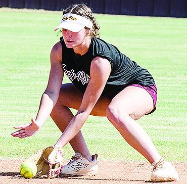 Reece Giblet fields the ball during a defensive drill in the middle of Clinton’s softball practice. CDN | Sam Goodwyn