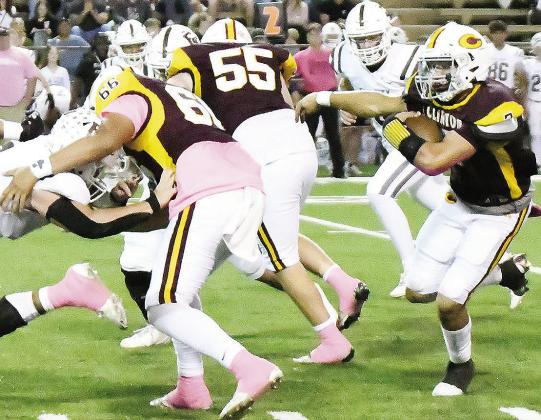 Clinton’s Easten Powell, right, carries the ball while No. 66 Andre Lime and No. 55 Bryson Snider provide blocks during the Red Tornadoes’ home win over Elk City Friday. CDN | John Kinsey