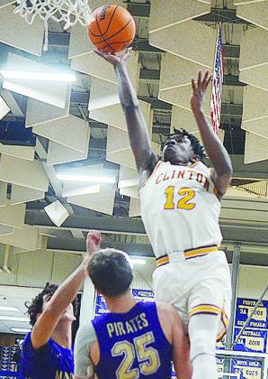 No. 12 Atticus Thompson takes flight as he takes the ball to the basket over a Mannford defender. CDN | Sam Goodwyn