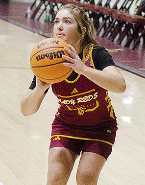 Clinton’s Laney Anderson gets into her stance as she prepares to shoot the ball during practice. CDN | Sam Goodwyn