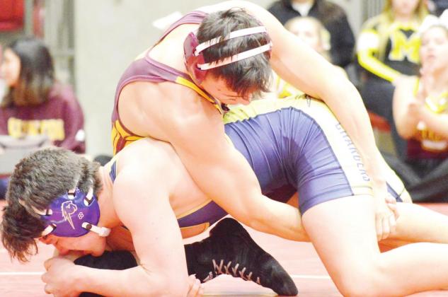 Mitchell wrestles some, preserves redshirt
