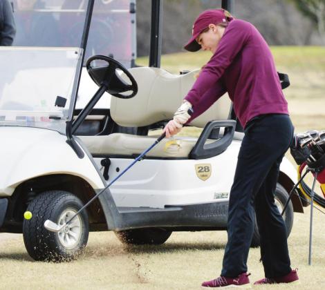 CDN | Collin Wieder Clinton senior golfer Kennedy Meacham swings through the ball at the Weatherford Tournament last year. Meacham averaged a sub-100 score for the season, helping the Lady Reds to the state tourney.