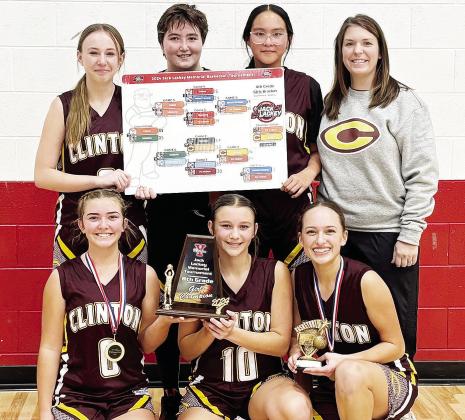 The Clinton Middle School eighth-grade team is all smiles after taking home the championship during the recent Jack Lackey Memorial Basketball Tournament in Yukon. Pictured in front, from left, are Laney Anderson, Hadley Meget, and Paisley Ruyle; back, Ma