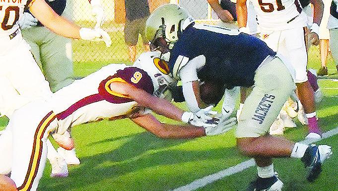 Clinton’s Parker Turney goes in for the tackle of the Kingfisher ball carrier during the Red Tornadoes’ road game Friday against the Yellowjackets. CDN | John Kinsey