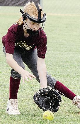 Stella McCarther focuses on the ball as she fields it in the OK Kids 8U Softball State Tournament at Schumacher Fields at Acme Brick Park. CDN |Sam Goodwyn