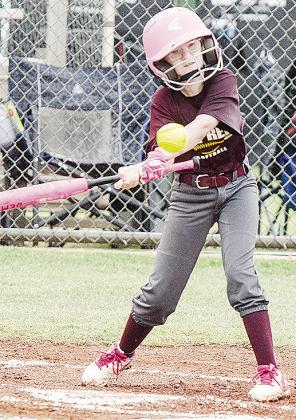 Brekyn Mach swings at the ball during Clinton’s softball game in the OK Kids 8U Softball State Tournament. CDN |Sam Goodwyn