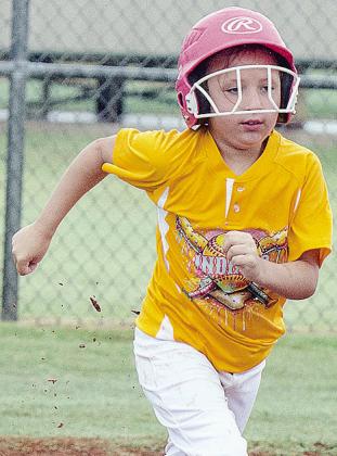 Kimber Lacy hustles to first during Arapaho-Butler’s softball game in the OK Kids 8U Softball State Tournament. CDN |Sam Goodwyn