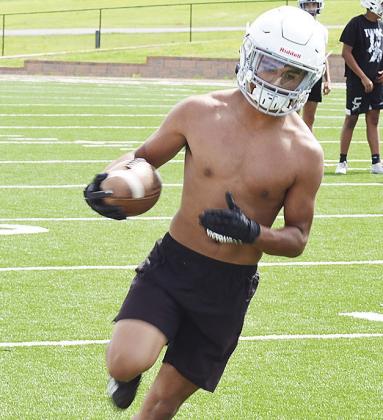 Jesus Gutierrez cuts upfield after catching the ball during practice at the Tornado Bowl. CDN | Sam Goodwyn