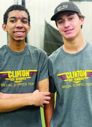 Malique Guy, left, and Scout Acosta smile as they take in the bocce ball tournament recently at the high school. CDN |Courtesy Photo