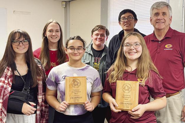 The Clinton High School “Froshmore” Academic Team, front from left, Brinley Taylor, Victoria Nemtan, Karly Wilson; back, Jaiden Mc-Cullough, Brittain Mosburg, Felipe Acosta Sandoval, and Coach Wes Miller show off their first-place plaques in the Mathe