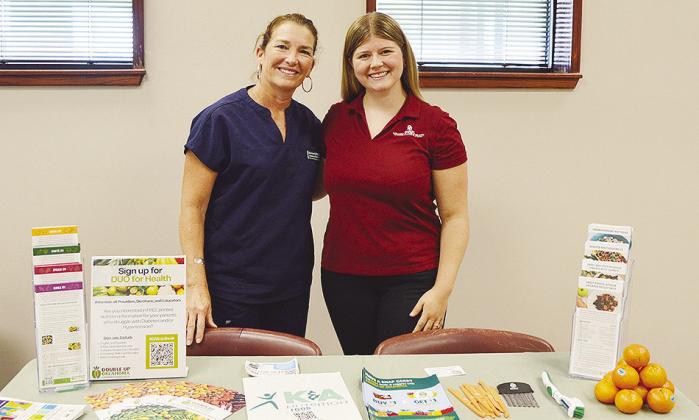 Clinton Regional Hospital Dietician DeAnne Foster, left, and DUO for Health Coordinator Madison Hemenway share a table recently at the Clinton Regional Hospital Health and Wellness event to help promote healthier diets to the community. CDN | Micah Ashcra