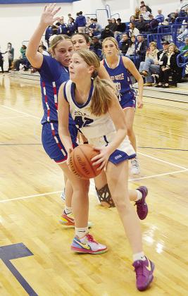 Corn Bible’s Audrey Stewart drives by a Bray-Doyle defender during the Lady Crusaders’ home game against the Lady Donkeys. CDN | Sam Goodwyn