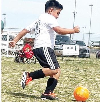 Mateo Gutierrez kicks the ball around during a youth soccer game at Acme Brick Park. CDN | Courtesy Photo