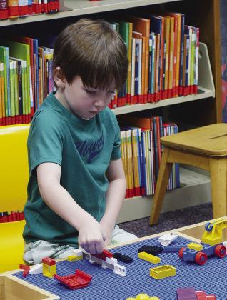 Jimi Haag is building his dream house out of Legos recently at the Clinton Public Library. CDN | Christian Jacobsen