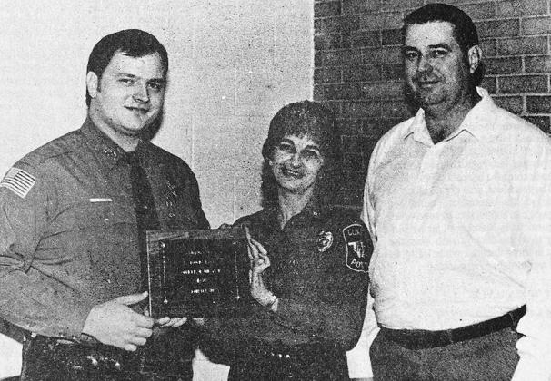 40 YEARS AGO Clinton Fraternal Order of Police members named John Q. Martin, left, as their “Officer of the Year” –– the first time the local FOP had presented such an honor. He was shown here accepting the plaque from FOP president Betty Coleman