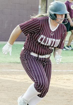 Lily Starnes hustles out of the box on her way to first during Clinton’s JV game against the Irish. CDN |Sam Goodwyn
