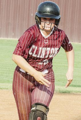 Sydnee Pugh hustles to third during Clinton’s home softball game Monday against Bishop McGuinness. CDN |Sam Goodwyn