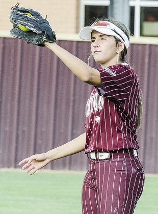 Clinton’s Emily Delarosa snags the ball during warm-ups Monday prior to the Lady Reds’ JV game. CDN |Sam Goodwyn