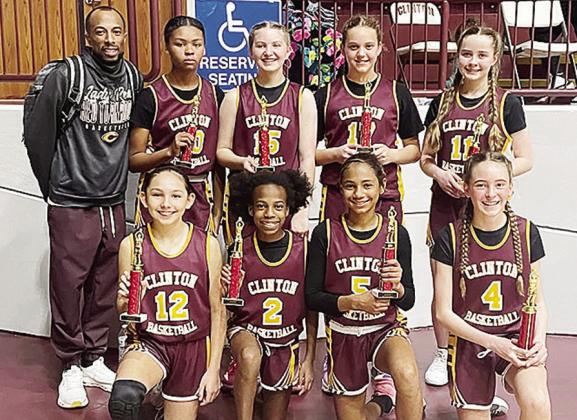 The sixth-grade girls’ basketball team shows off championship trophies from a recent tournament at the Tornado Dome. This group has won all but one tournament as a team. Pictured in front, from left, are Brielle Villalpando, Kynnedi Jefferson, Catalaya 