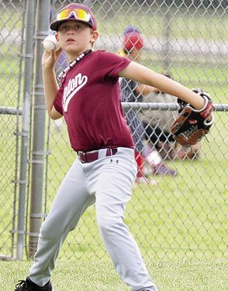 CDN |Sam Goodwyn Timber Hartman throws the ball to the pitcher during Clinton’s contest against Altus in the OK Kids 8U Baseball Tournament at Schumacher Fields at Acme Brick Park.