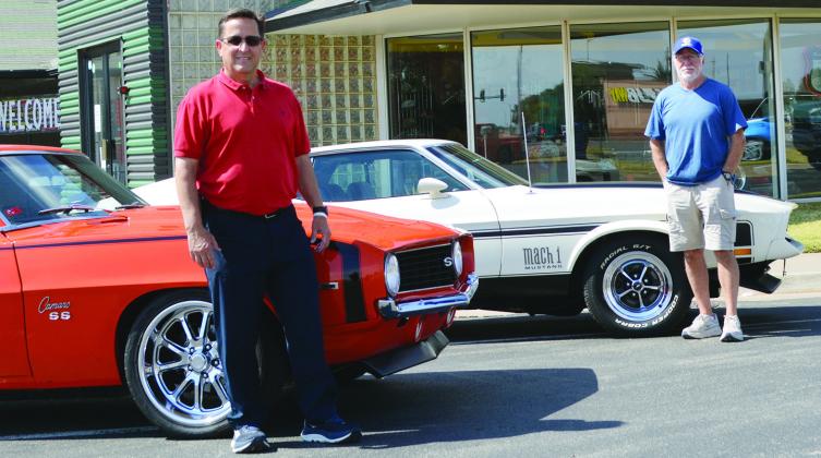 Shane Vice, left, with his 1969 Chevy Camero SS and David Cleek driving his 1972 Model Mach 1 Mustang Cobra Jet visit the Oklahoma Route 66 Museum before this weekend’s car show. CDN | Christian Jacobsen