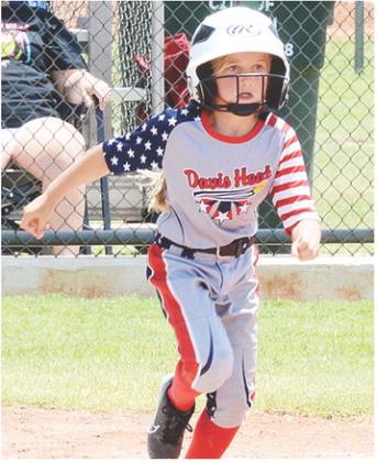 Bryndel Grace Dunn hustles to first during the Davis Heat’s game against Cordell Thursday in the OK Kids 8U State Softball Tournament at Schumacher Fields at Acme Brick Park. CDN | Sam Goodwyn