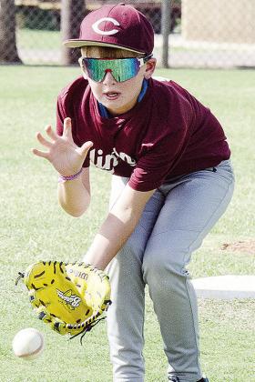 Garrett Stockton watches the ball during Clinton’s baseball game in the OK Kids 8U Baseball State Tournament. CDN |Sam Goodwyn