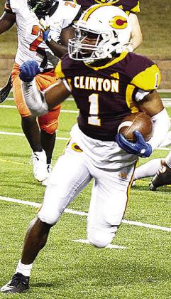 No. 1 Derren Hester plants his foot as he tries to change direction carrying the ball in Clinton’s final home game of the regular season against Douglass. CDN | Micah Ashcraft