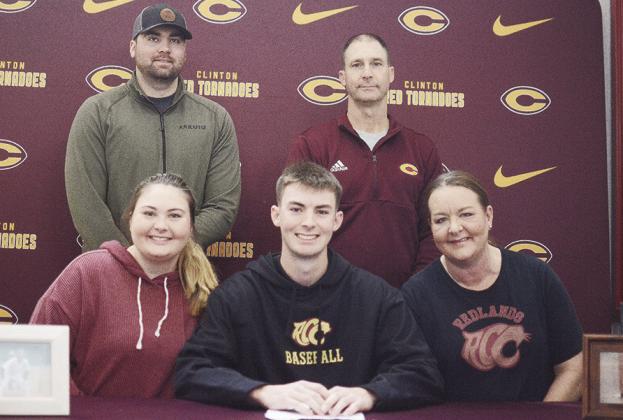 Clinton’s Craig Hunter, center, celebrates with his family after signing to play college baseball with Redlands Community College in El Reno. Pictured in front, from left, are his sister Blair, Hunter, his mom Amy; back, his brother Patrick and dad Aaro
