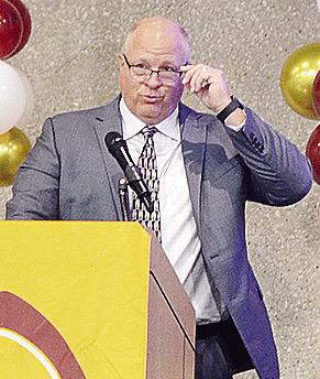 Coach John Higbee speaks to the crowd at the Frisco Center Monday during the endof-